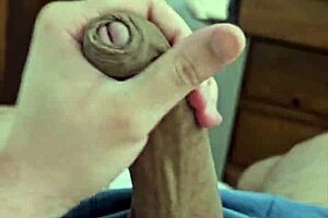 Young Brazilian twink shows off his massive hard cock.