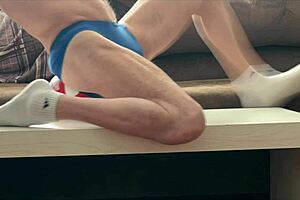 On the table in tight briefs for volleyball muscle relief