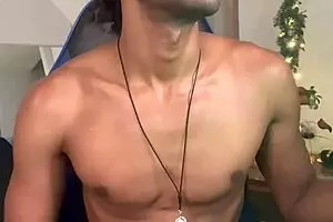 A beautiful black twink with a big dick in an interracial scene